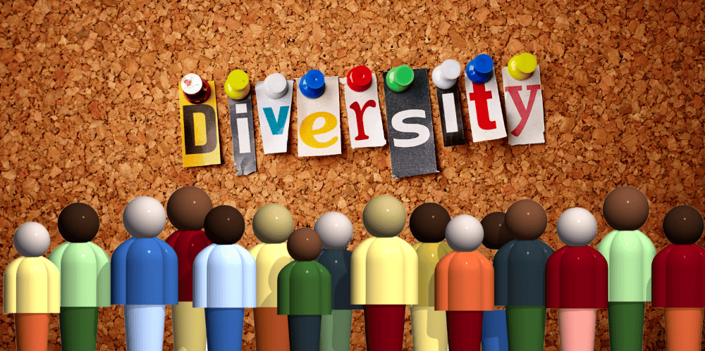 diversity pinned to a board with cartoon people looking at it